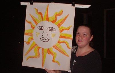 Woman holding sun banner